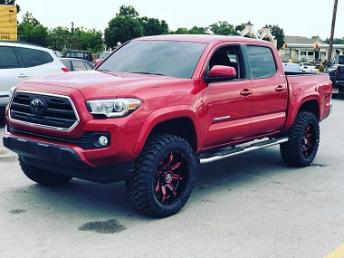 Lifted Toyota truck with Zone Offroad Suspension, RBP Tires, and XF Wheels